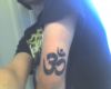 Om tattoo design on hand